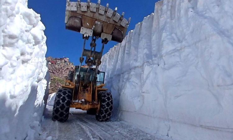 Road clearing operations in 6 meters of snow in July